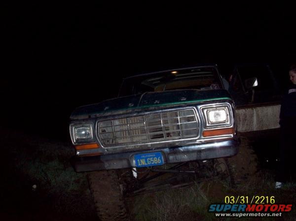 Front view of a green Ford F-Series truck, possibly a 1979 model, with a license plate reading 1NL G586