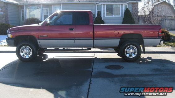1997 Dodge 2500 pickup truck, side view, red and grey two-tone paint