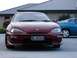 1993 Mazda MX-3 - Front view of a red 1993 Mazda MX-3 parked outside next to another car.