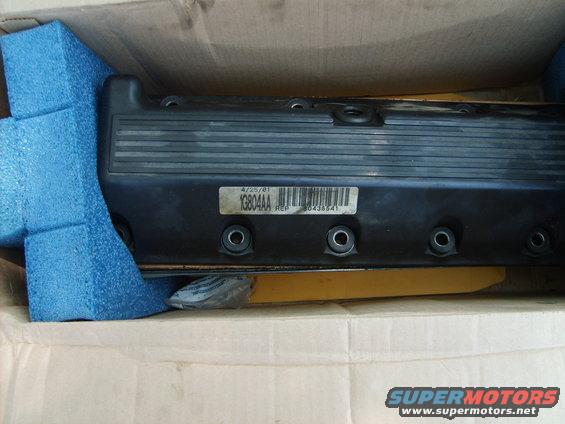Black valve cover with a "4/25/01" date stamp and part number "1G804AA"