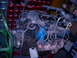 1989 Ford Bronco - Engine assembly with blue intake manifold and rusted exhaust manifolds, mounted on a green stand.