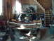 1978 Ford Mustang II - Car body in a state of disassembly inside a garage with various items stored around it.