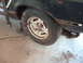 1978 Ford Mustang II - This photo shows a close-up of a car's wheel and fender, with visible rust.