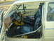 1983 Volkswagen Rabbit - The interior of a car is visible, a roll cage and black seats. The registry claims it is a 1983 Volkswagen Rabbit, but this cannot be confi…