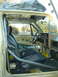1983 Volkswagen Rabbit - Car interior modified with a roll cage and racing seats, showing sound dampening on the ceiling and doors.
