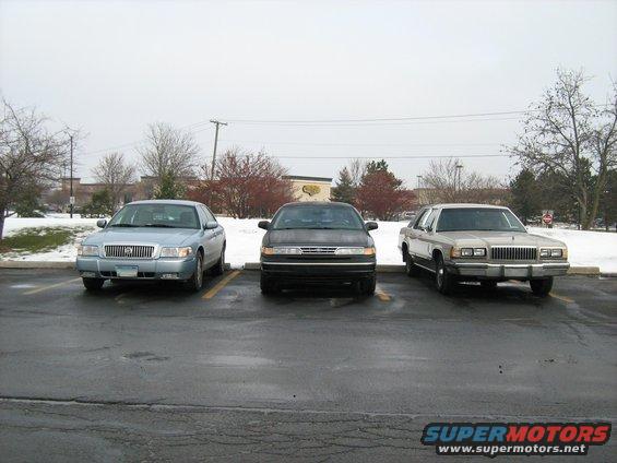 1988 Mercury Grand Marquis front view parked next to two other sedans
