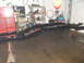 1997 Ford Ranger - Vehicle frame is supported by jack stands in a garage setting, with tools and shelves visible in the background.