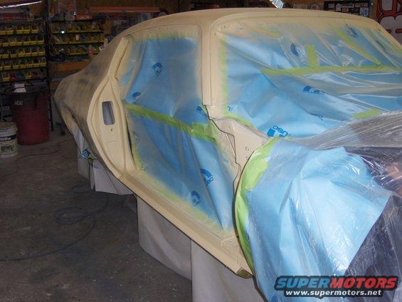 1971 Chevrolet Camaro door and quarter panel covered in masking plastic and tape
