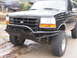 1994 Ford Bronco - Front view of a 1994 Ford Bronco modified with a heavy-duty bumper and larger tires.
