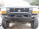 1994 Ford Bronco - This 1994 Ford Bronco features a robust aftermarket bumper and a classic grille, its front profile.