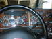 2003 Peterbilt 379 - Interior view of a truck's dashboard, showing numerous gauges and a steering wheel.
