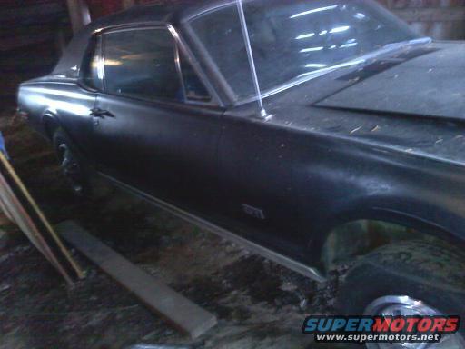 1968 Mercury Cougar coupe parked indoors, side view showing front fender and door