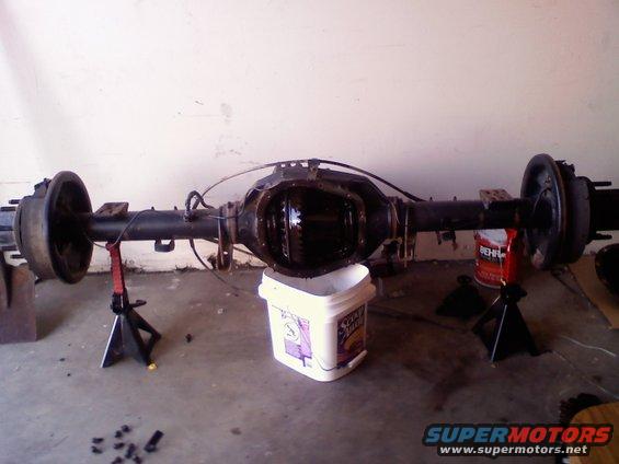Rear axle assembly on jack stands, differential cover removed