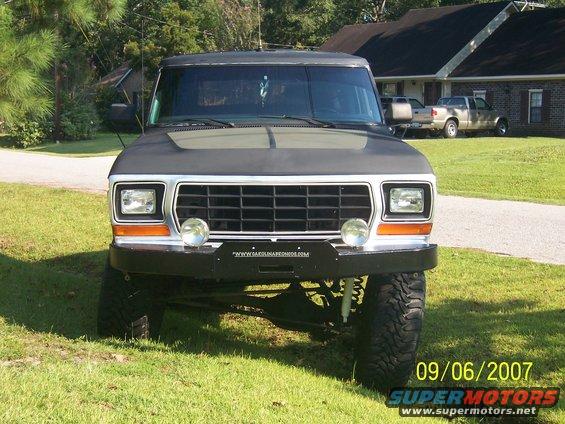 Black Ford Bronco with aftermarket bumper and large tires, front view