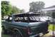 1979 Ford Bronco - This SUV has a roll cage and a fire extinguisher visible inside. Another vehicle is parked behind it.