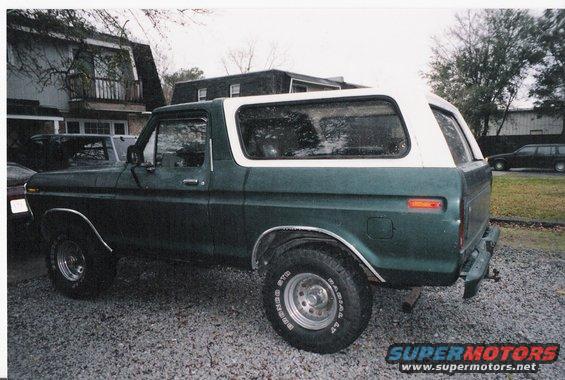 Green and white 1979 Ford Bronco, side view