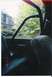 1979 Ford Bronco - View from inside a vehicle shows a residential house and trees through the window.