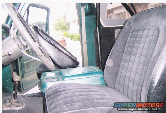 1979 Ford Bronco interior showing front seats, steering wheel, and floor shifter