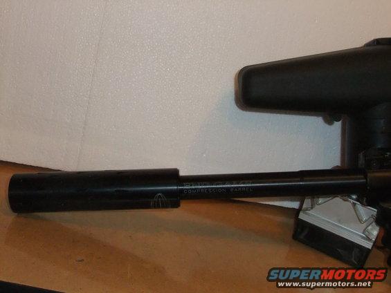 Paintball gun barrel with text 'COMPRESSION BARREL' visible