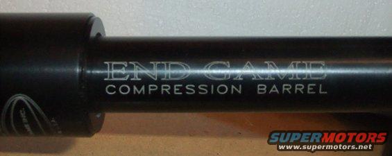 Black metal barrel with 'END GAME COMPRESSION BARREL' text and a Supermotors logo