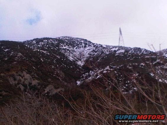 Mountain landscape with snow and power lines