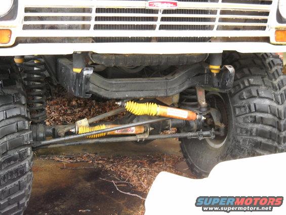 1982 Ford Bronco front suspension with yellow shocks and grille