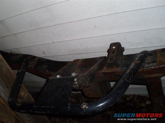 Frame with aftermarket skid plate, close-up view
