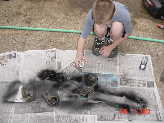 87-work-begins-126.jpg The boy is helping me paint the small parts