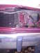 1988 Ford Crown Victoria LTD - Damage to the front end of a red vehicle, revealing the radiator and bumper structure.