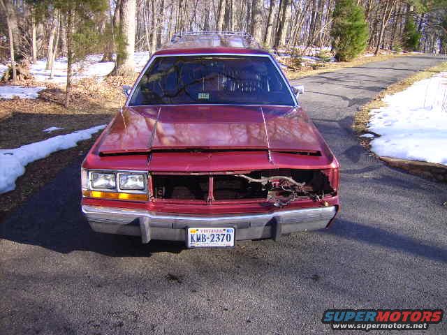 red station wagon, front damage, Virginia plate KMB-2370