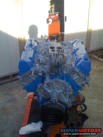 Blue and silver engine on stand