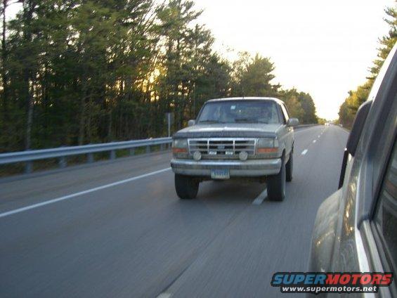 1994 Ford Bronco driving on highway, seen from another vehicle