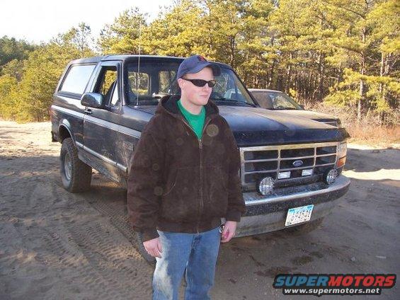 Black 1994 Ford Bronco front 3/4 view with person