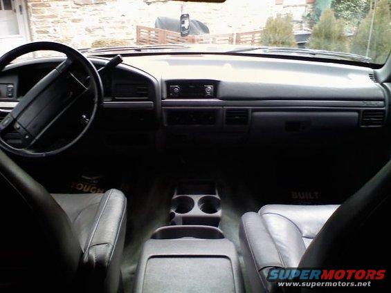Interior of a 1992 Ford Bronco showing the dashboard, steering wheel, and seats