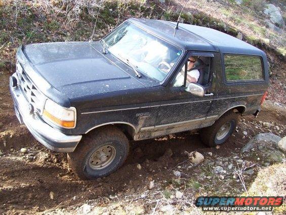 Black 1994 Ford Bronco navigating rough terrain