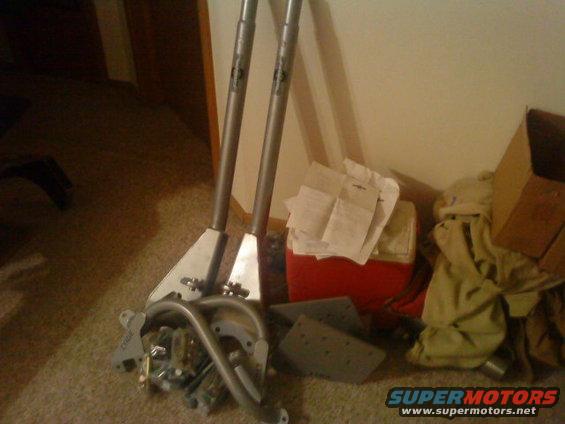 Metal assembly with two poles and attached hardware