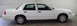 1994 Honda Accord - Side profile of a white sedan, likely a Ford Crown Victoria, in an indoor setting.
