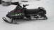 1990 Arctic Cat El Tigre EXT - An Arctic Cat snowmobile with EXT and el Tigre graphics sits in a snowy outdoor setting.