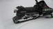 1990 Arctic Cat El Tigre EXT - A black Arctic Cat El Tigre EXT snowmobile is parked in the snow, showing its track and side profile.
