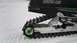 1990 Arctic Cat El Tigre EXT - Detail of a snowmobile's track and suspension system, with 'ARCTIC CAT' branding visible.