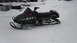 1990 Arctic Cat El Tigre EXT - A black 1990 Arctic Cat El Tigre EXT snowmobile sits in a snowy outdoor setting.