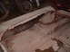 1963 Ford Galaxie - Severe rust damage on the trunk floor of a car, with a motorcycle visible behind it.