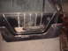 1963 Ford Galaxie - Close-up of a vintage car's interior door panel, showing the design of the handle and trim.