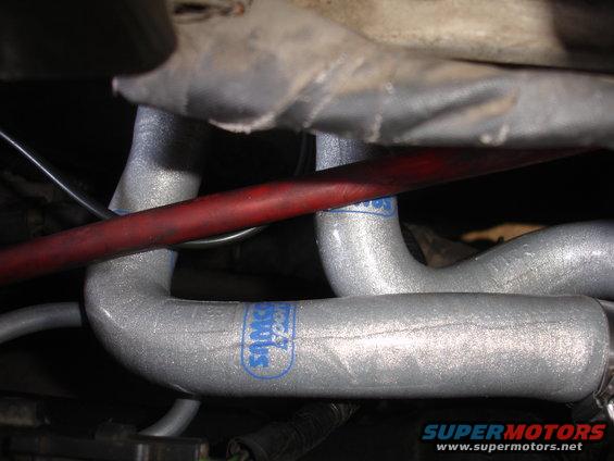Silver engine hoses with blue "Samco Sport" logo