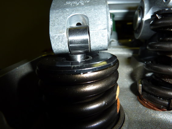 Close-up of a valve spring and rocker arm assembly with 'Yella Terra 1.75' visible