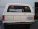 1986 Ford Bronco - Rear view of a white 1986 Ford Bronco, showing its tailgate and license plate.