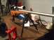 1996 Ford Bronco - Rifle with scope and bipod rests on a table, with reloading equipment nearby.