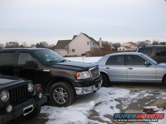 jeep.jpg My sister's 2000 jeep wrangler and my brother's 2004 lariat F-150 fully loaded and a 2006 explorer on the other side