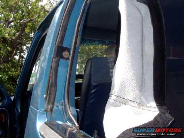 skylertop4.jpg side mounting bracket. The tab on the interior trim needs to be cut flat so it doesn't stick out (above the bolt)