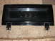 1979 Jeep CJ7 - This black tailgate features the embossed Jeep logo and hinges, likely from an older Jeep model.